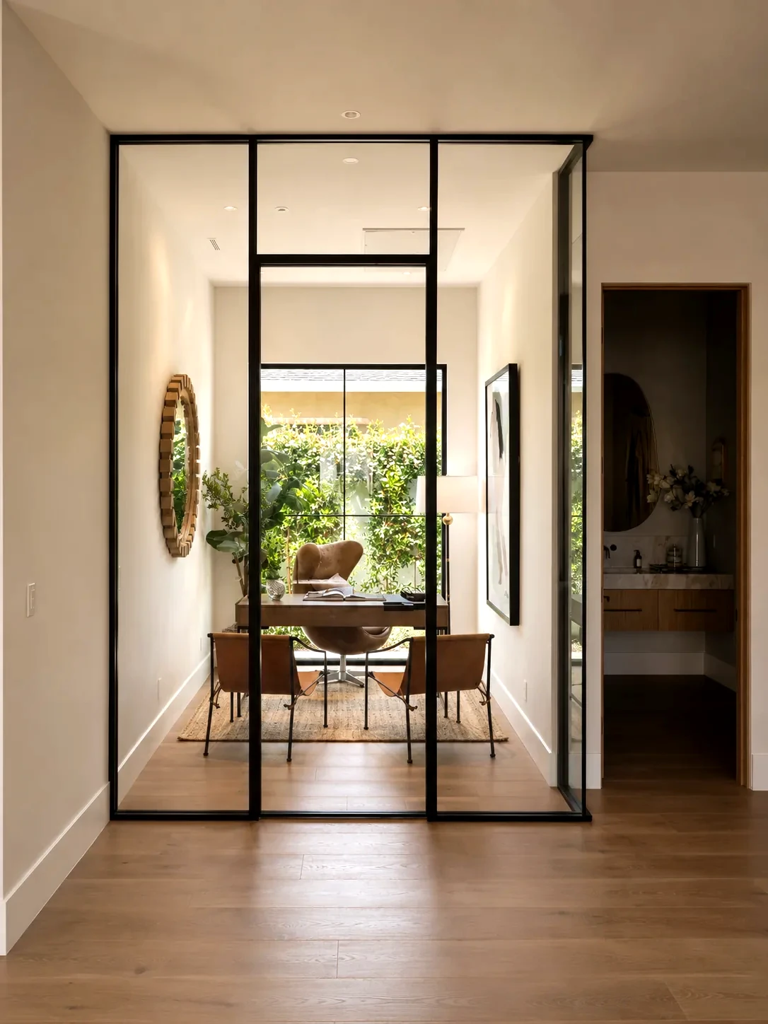 Aeres pivot-door glass partition in an office