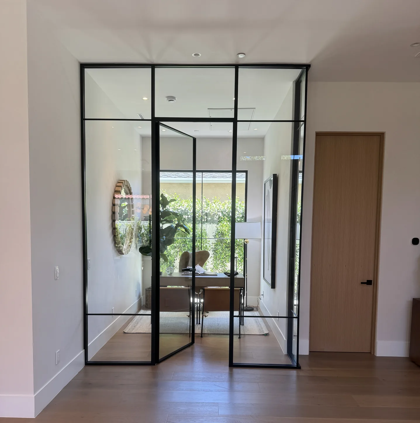 Aeres corner glass partition wall enclosing a home office