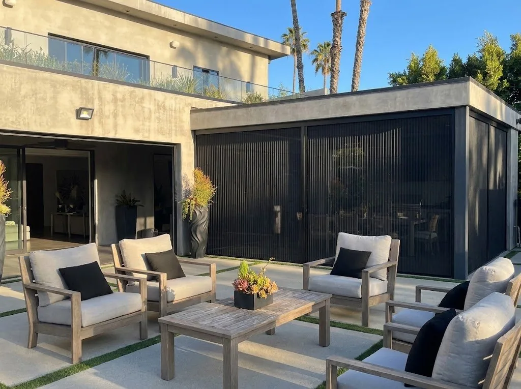Aire pleated screen enclosing an LA patio lounge at golden hour